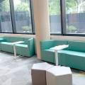 The American Club - Claymore Hill | Product Seen: [Elevate Height Adjustable Table, Seed Modular Stool, Rio Rhombus Arm Sofa (Modular), Rio Parallelogram Arm-less Sofa (Modular) & Rio Trapezium Arm Sofa (Modular)]
